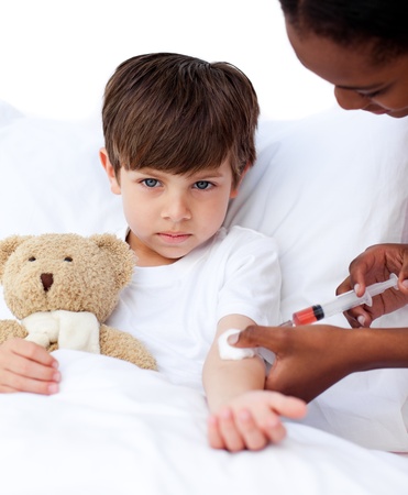 Adorable little boy receiving an injection の写真素材