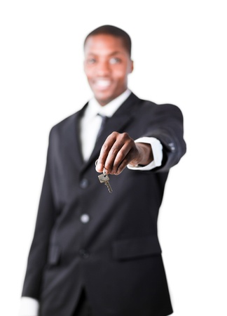 Young businessman holding a keyの写真素材
