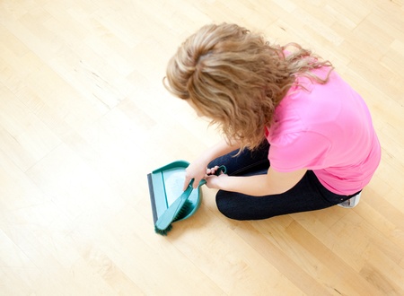 Blond woman doing housework の写真素材