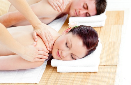 Young caucasian couple receiving a back massageの写真素材