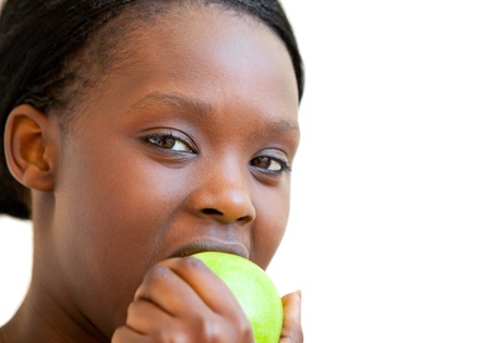 Sweet woman eating appleの写真素材