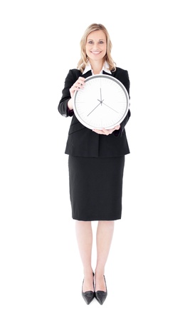 Glowing businesswoman holding a clockの写真素材
