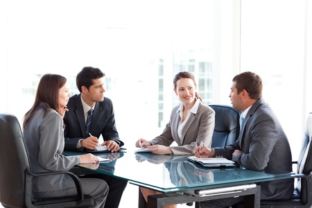 Businessmen and businesswomen talking during a meeting