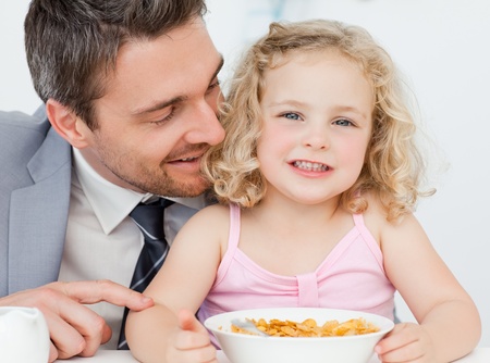 Father having breakfast with hisdaughter