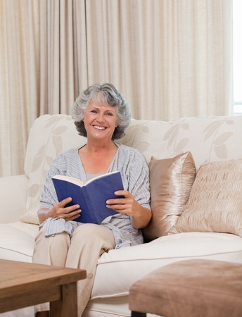 Senior woman reading her bookの写真素材