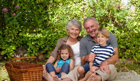 Happy family picnicking in the garden 