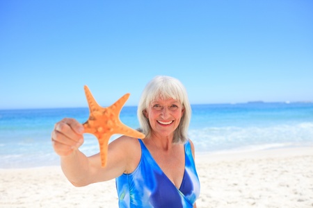 Elderly woman with her star seaの写真素材