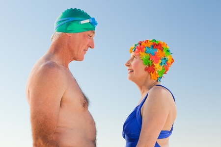 Enamored elderly couple at the beachの写真素材