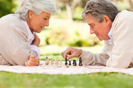Elderly couple playing chessの写真素材