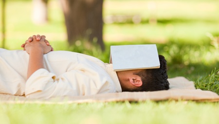 Man sleeping with his bookの写真素材