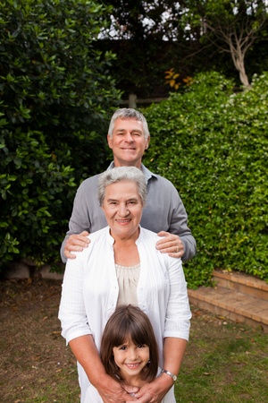 Grandparents with their grandchildren looking at the camera