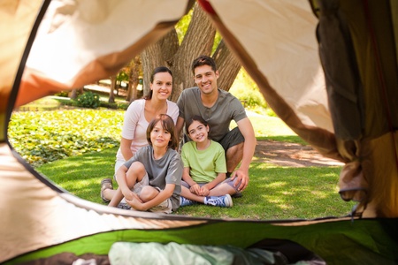 Joyful family camping in the parkの写真素材