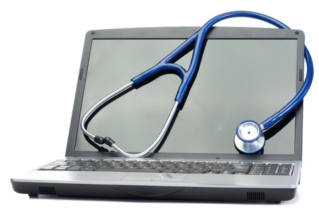 Blue stethoscope and laptop on a white backgroundの写真素材
