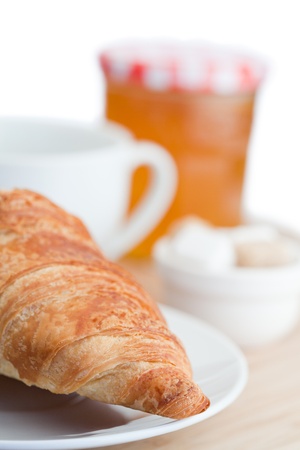 Breakfast with coffee marmalade and croissants on a white backgroundの写真素材