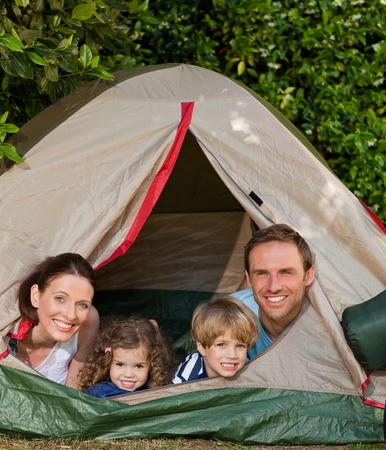 Joyful family camping in the gardenの写真素材