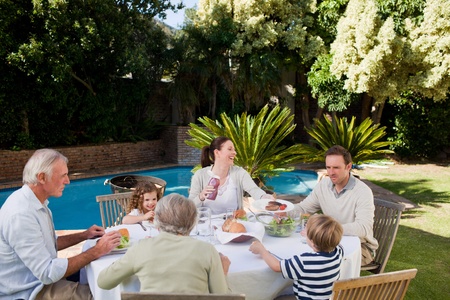 Family eating in the gardenの写真素材