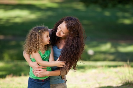 Daughter with her mother in the parkの写真素材