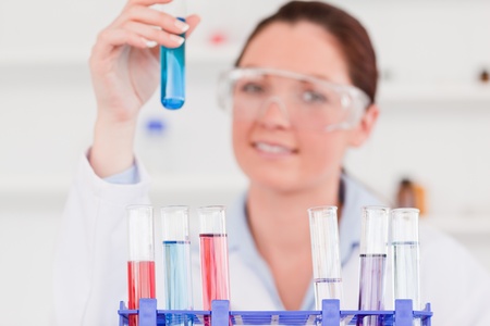 Young scientist storing a test tube
