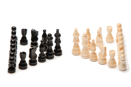 Dark and white pieces of chess on a white backgroundの写真素材
