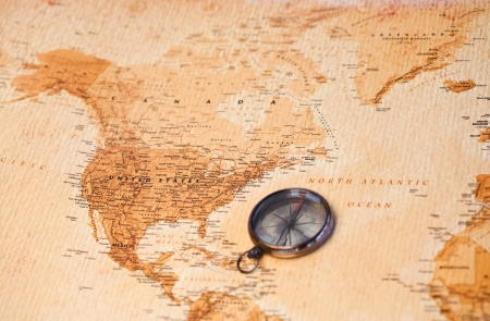 World map with compass showing North Americaの写真素材