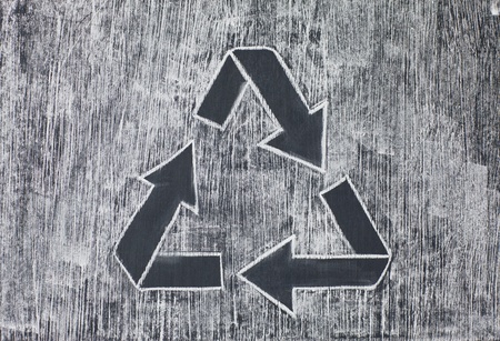 Recycle symbol on a white chalky backgroundの写真素材