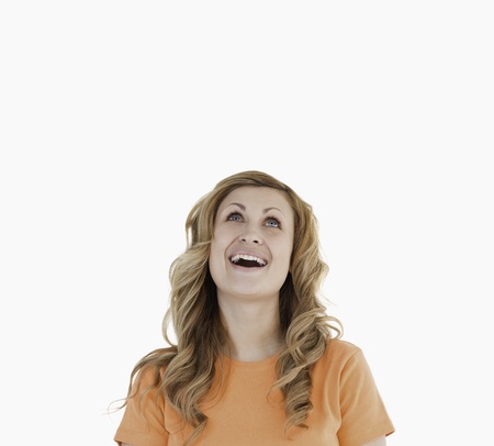 Happy attractive woman against a white backgroundの写真素材