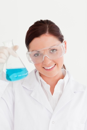 Cute scientist looking at the camera in a laboratoryの写真素材