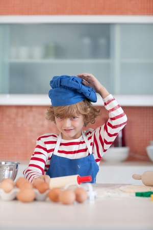 Positive little boy with a blue capの写真素材