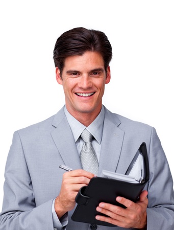 Charismatic businessman holding an agenda の写真素材
