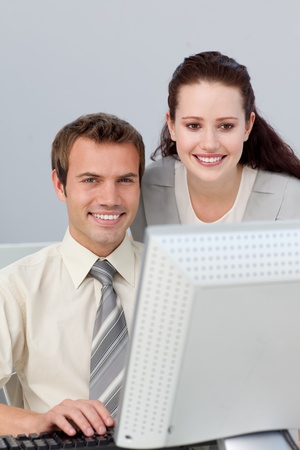 Confident businesswoman helping her colleague の写真素材
