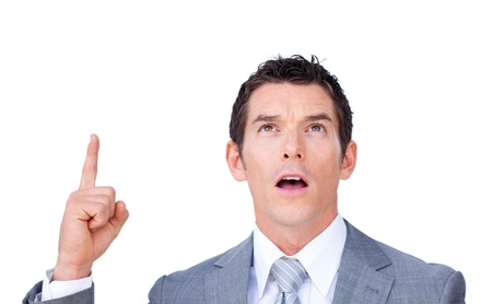 Surprised businessman pointing upward の写真素材