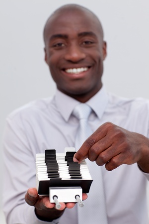 Afro-American businessman looking at an index holderの写真素材