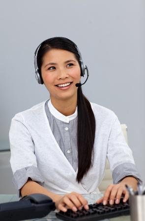 Ethnic businesswoman with headset on の写真素材