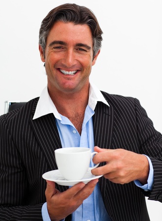 Attractive businessman drinking coffeeの写真素材