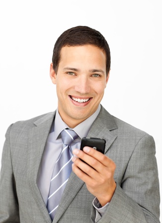 Attractive businessman sending a text の写真素材