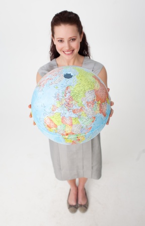 Young businesswoman holding the Earth planetの写真素材