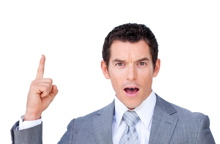 Astonished businessman pointing upward の写真素材