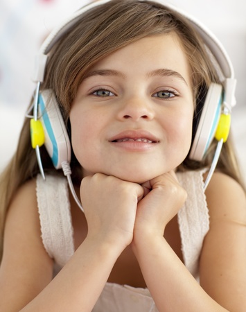 Portrait of little girl listening to the musicの写真素材
