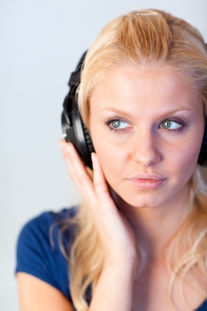 Portrait of a woman listening music with headphones の写真素材