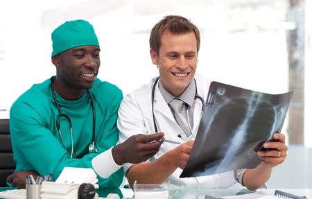 Two doctors examining an x-ray 