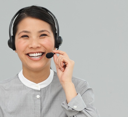 Asian customer service agent with headset onの写真素材
