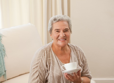 Mature woman drinking some tea