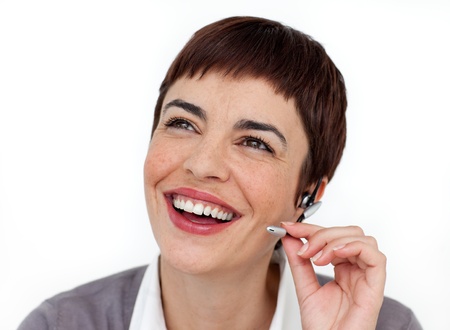 Smiling customer service representative using headset の写真素材