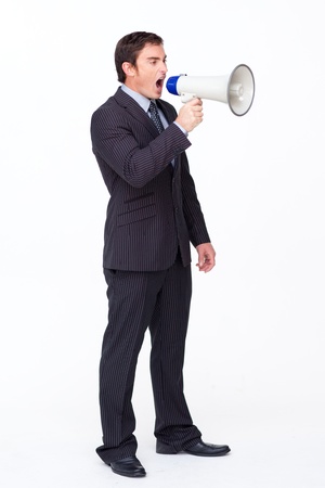 Standing businessman shouting through a megaphoneの写真素材