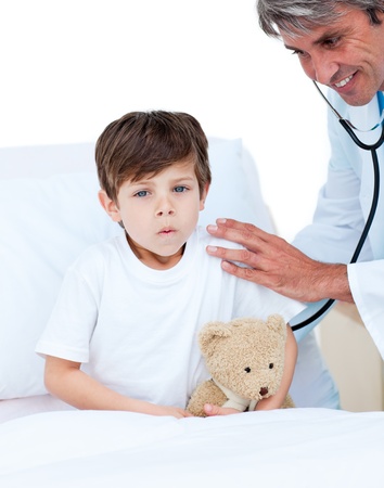 Cute little boy attending a medical check-up の写真素材
