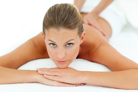 Reposing woman enjoying a massageの写真素材