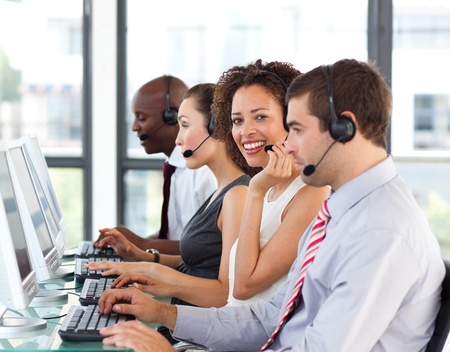 Smiling businesswoman working in a call centerの写真素材