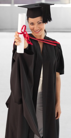 young woman Graduating holding her Diplomaの写真素材