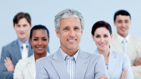 Smiling business team showing ethnic diversity Smiling business team showing ethnic diversity
