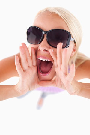 Charming lady with sunglasses in high spirits in a studioの写真素材